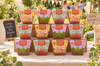 Twelve Kids Garden grow kits arranged as favors at a garden birthday party