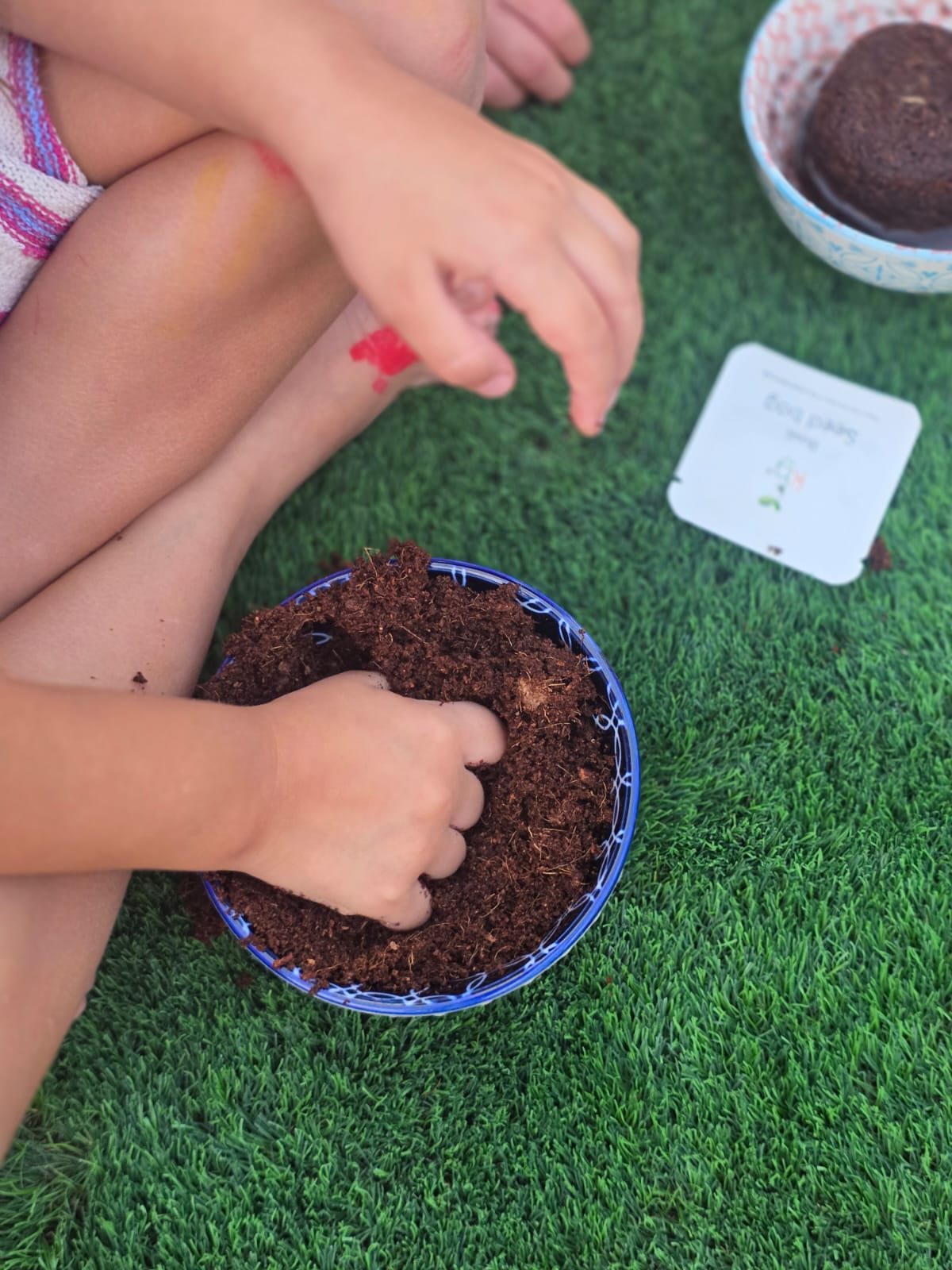 Children planting Kids Garden grow kits at a birthday event