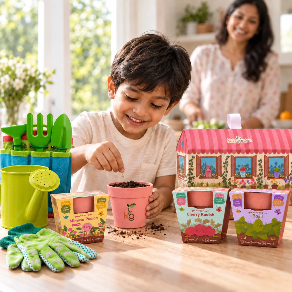 Child planting seeds with the Little Gardener Set in blue and green, with his mother nearby